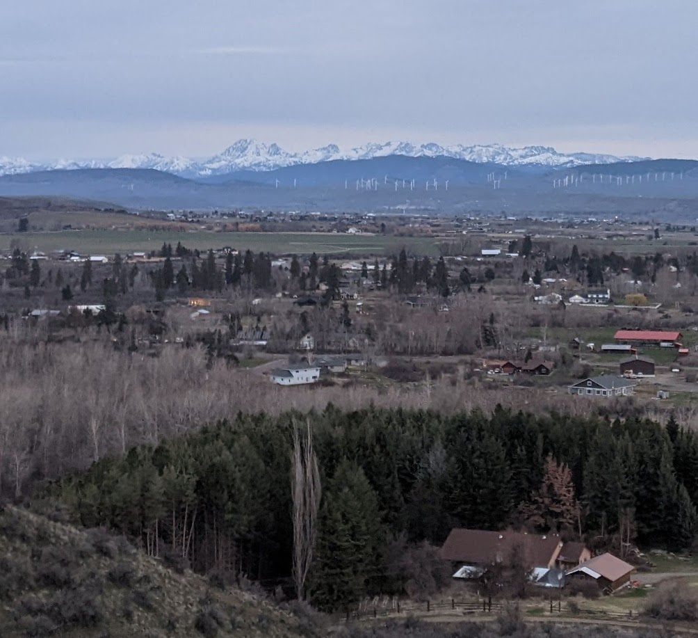 A view from a mountain looking down at a sea of widely-spaced houses. A deeply desirable location for many Americans.
