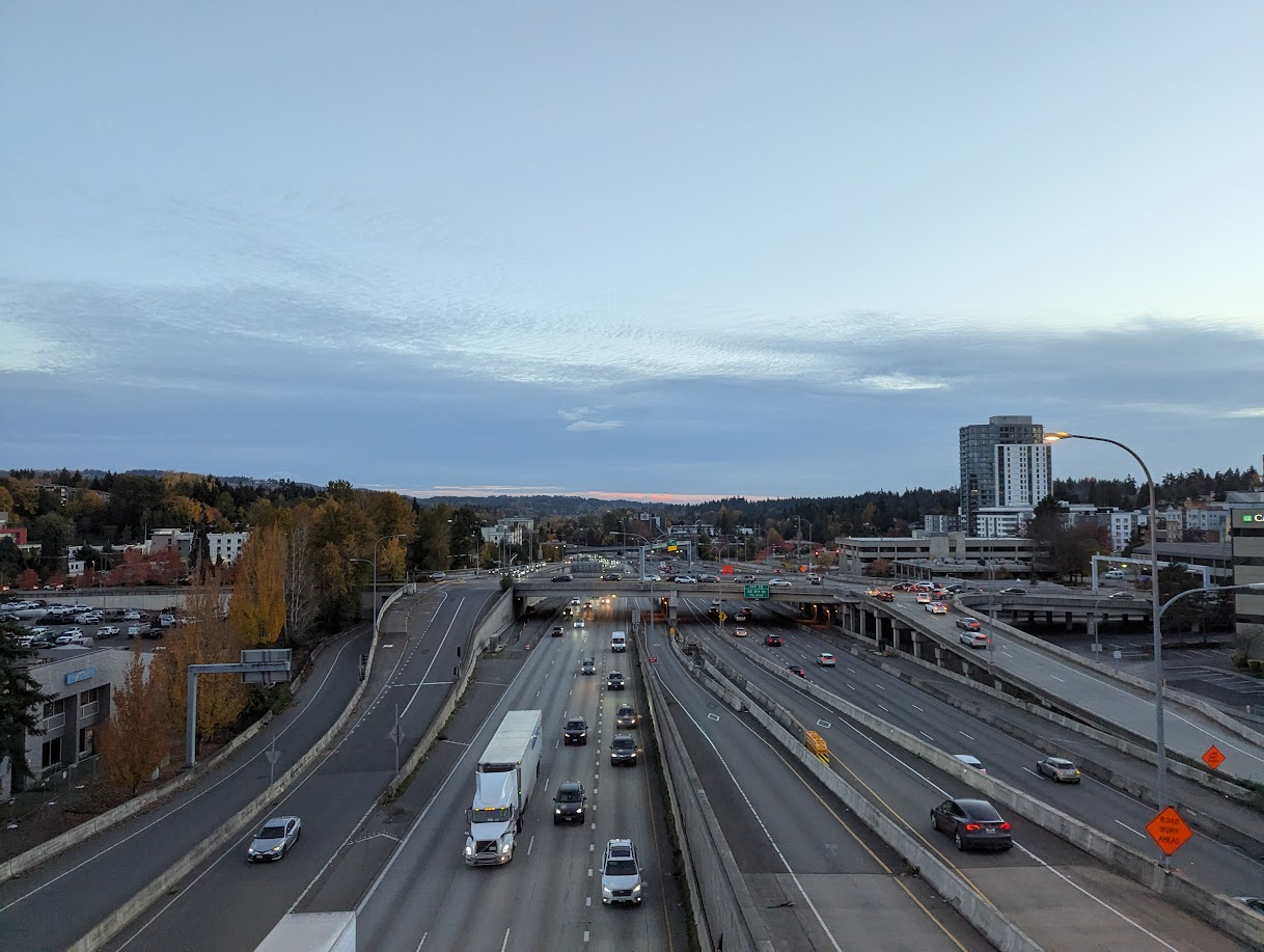 Looking at a freeway that has a mere 15 lanes. Only one building taller than 5 stories is visible in the shot.