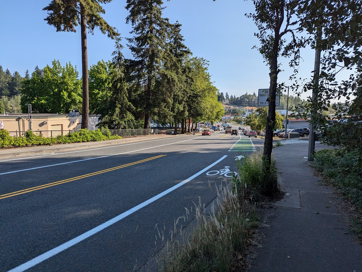 Looking down a typical American car sewer. But there is a freshly-painted bike lane along it.