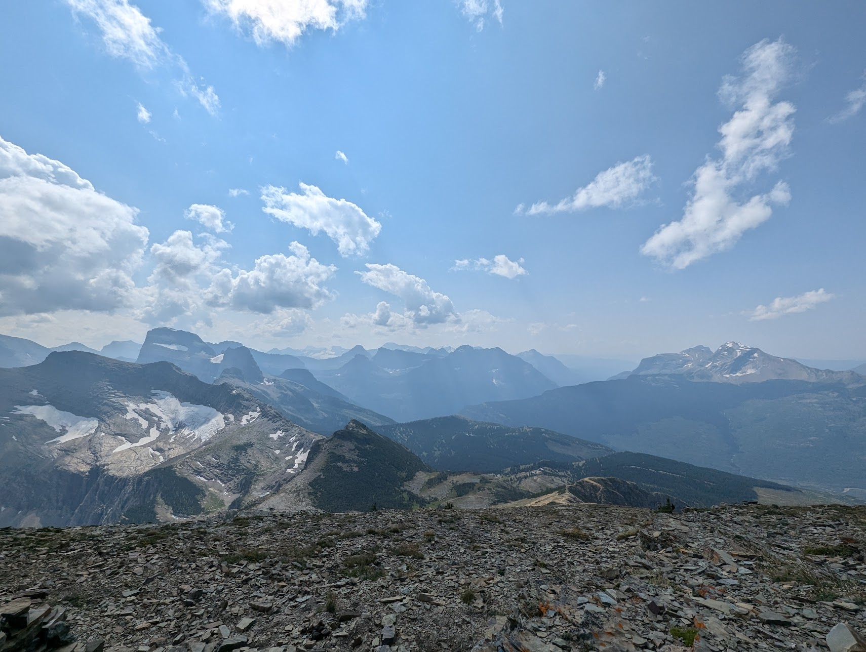 View from the summit. Many mountains in the distance.
